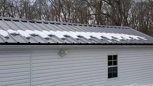 snow guards on a metal roof